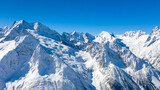 Fototapeta Góry - Caucasus Mountains, Panoramic view of the ski slope with the mountains Belalakaya, Sofrudzhu and Sulakhat on the horizon in winter day. Dombai ski resort, Western Caucasus, Karachai-Cherkess, Russia.