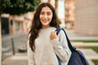 © Krakenimages.com - Young middle east student girl smiling happy standing at the city.