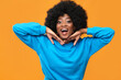Fashionable black woman on orange background.