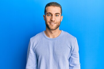 Sticker - Young caucasian man wearing casual clothes with a happy and cool smile on face. lucky person.