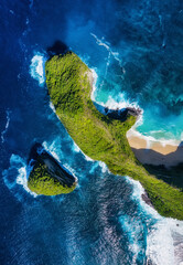 Wall Mural - kelingking beach, nusa penida, indonesia. aerial view at sea and rocks. blue water background from t