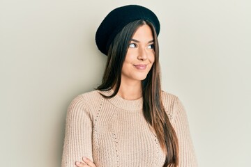 Poster - Young brunette woman wearing french look with beret smiling looking to the side and staring away thinking.