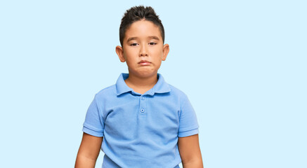 Sticker - Little boy hispanic kid wearing casual clothes depressed and worry for distress, crying angry and afraid. sad expression.