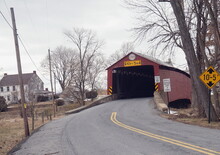 Entrance To Red Covered Bridge With Hex Sign