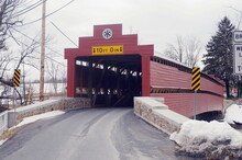 Red Covered Bridge With Hex Sign In Winter