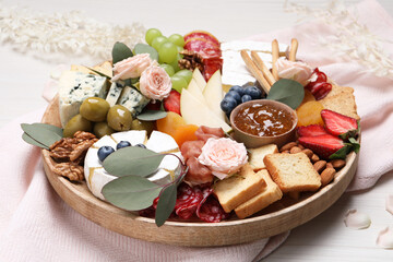 Assorted appetizer served on white wooden background