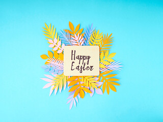 Easter greeting card. Paper blank on blue background. Flat lay, top view.