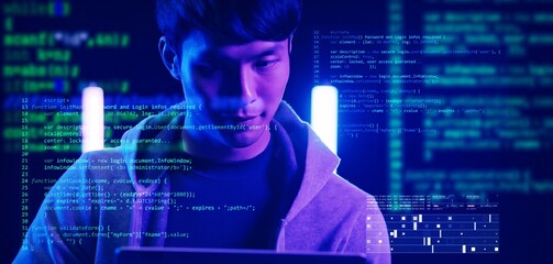 Asian man using computer with futuristic NFT GameFi computer code preview, computer engineer program developer typing code, internet digital technology security concept.
