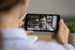 © fizkes - Close up of woman have video call on modern cellphone with smiling Caucasian male colleague or friend. Female client talk speak on webcam digital conference on smartphone. Virtual event concept.