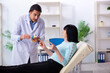 © Elnur - Old woman visiting young doctor dentist