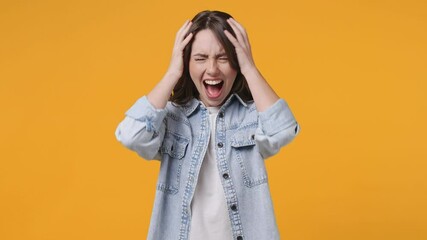 Wall Mural - displeased crazy frustrated young brunette woman 20s in denim jacket white t-shirt posing isolated o