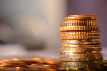 Canvas Print - Stack of coin on table background and business or finance saving money