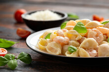 Italian Conchiglie Prawn, Shrimp Pasta In A Creamy Sauce On Plate.