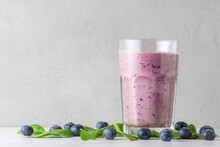 Glass Of Blueberry And Spinach Smoothie Or Milkshake With Fresh Berries. Healthy Drink
