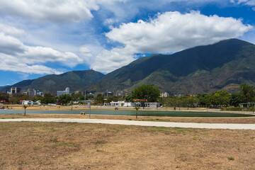 Wall Mural - Caracas, Venezuela, 03.07.2021: view of the lake in the East Park with the Avila mountain in the background.