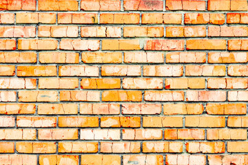 Texture of a brick wall with cracks and scratches which can be used as a background