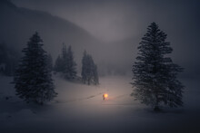 Cold Winter Night Scenery Wit Warm Light And A Man With Holding A Lantern