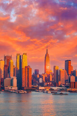 Wall Mural - Manhattan skyline illuminated by sunset
