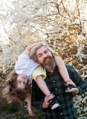 Wall Mural - Happy kid shoulder ride on dad. Fathers Day. Father Son relationships. Friendly family relationships.