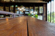 © Yuphayao Pooh's - Empty wood table and blurred light in coffee shop.