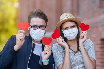 Sticker - Adult romantic couple wearing masks on the walk in the city