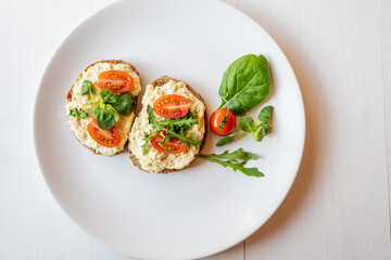 Wall Mural - egg cheese ham dip, spread on open finger food sandwich with salad, tomato vegetables 