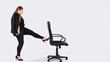 © Viorel - Angry female boss firing employee. Dismissed frustrated business woman pushing office chair with foot. Business concept unemployment, crisis, jobless and employee job reduction