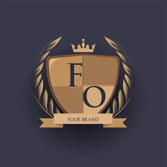 initial letter FO logotype colored brown and gold isolated with shield, crown and laurel design, logo for college and sport club.