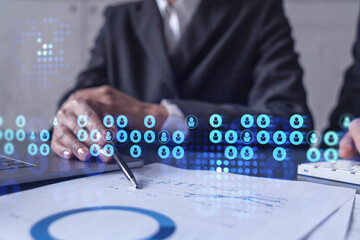 Two HR specialists man and woman analyzing the market of alumni to boost the intern program at international consulting company. Hiring new talented officers. Social media hologram icons.