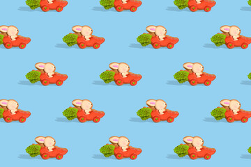 Wall Mural - . Easter decoration. Pattern for festive Easter packaging. Happy easter. Rabbit on a car in the shape of a carrot.