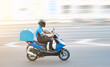 © Tricky Shark - Food delivery boy on motorcycle moving fast to deliver food to customers, home and office delivery on motorbike, pizza online order. Express delivery service from cafes and restaurant, internet orders