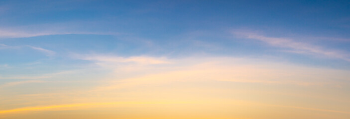 Wall Mural - beautiful vivid sky painted by the sun leaving bright golden shades.dense clouds in twilight sky in 