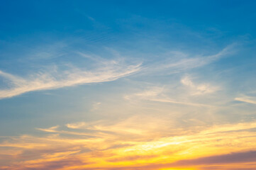 Wall Mural - beautiful vivid sky painted by the sun leaving bright golden shades.dense clouds in twilight sky in 