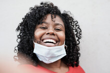 Beautiful Young African Woman Taking A Selfie While Wearing Surgical Face Mask Under Chin
