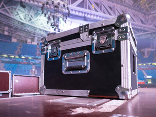 Box rack for transportation of concert equipment. Wardrobe trunk on background of concert venue. Rack wardrobe trunk on stage. Concept - sale of rack cases for concert equipment. Musical equipment