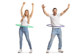 Sticker - Full length portrait of a young man and woman spinning hula hoops