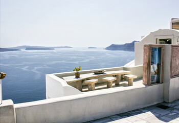  Santorini, Greece : A pot with flower or plant and a plate on a wooden table with ocean background