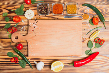 composition with wooden board and ingredients for cooking on table