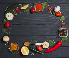 Wall Mural - Spices and herbs over wooden background, healthy or cooking concept.