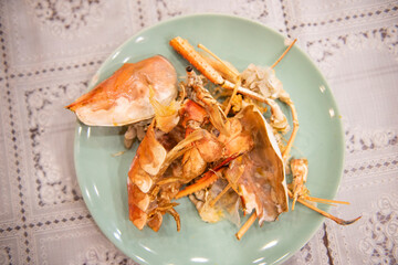 food waste plate with shellfish - Plate after eating seafood shrimp prawn, dirty dishes