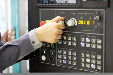 Canvas Print - operator changes settings of the CNC machine