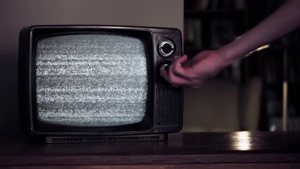 Wall Mural - male hand hitting an old tv set until green screen appears. you can replace green screen with the fo