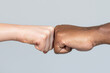 © Yevhen - Black African American race male and woman hands giving a fist bump, multiracial diversity, immigration concept. Stop racism campaign. Closeup of multicultural friends giving fist bump to each other