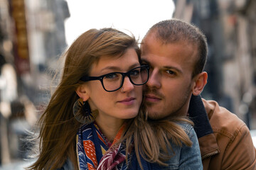 Young couple enjoying on the urban streets.