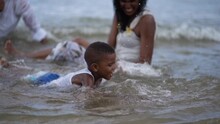 African American Boy Having Fun On The Beach