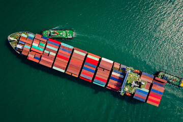 Aerial top view from drone, Container ship  sailing on the green sea