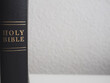 Black holy bible with white background and copy space