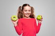 Cheerful child with donut and apple