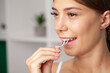 © Maksymiv Iurii - Portrait of beautiful woman cleaning teeth with dental floss