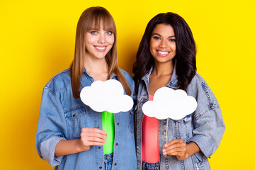 Photo of charming positive girls dark skin hand hold cloud empty space figure isolated on yellow color background